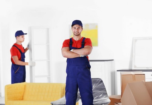 Removal team preparing household items for transport