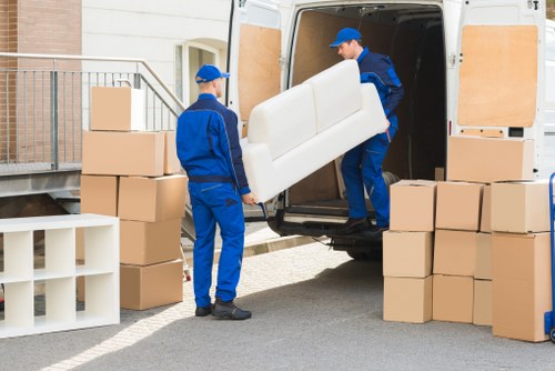 Professional movers loading furniture for local removals in Isleworth