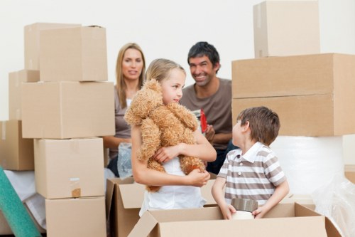 Moving team unloading boxes at a family home in Isleworth